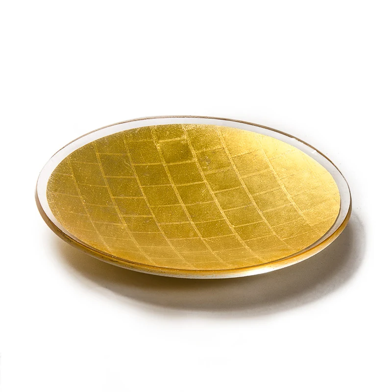 Round gold mosaic platter viewed from above