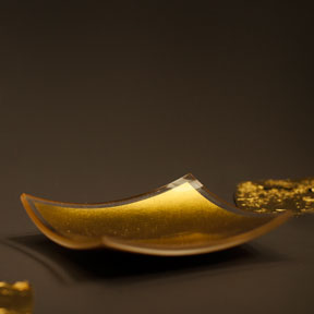 Plain gold leaf held in a square glass platter