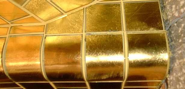 Close detail of gold mosaic tiles